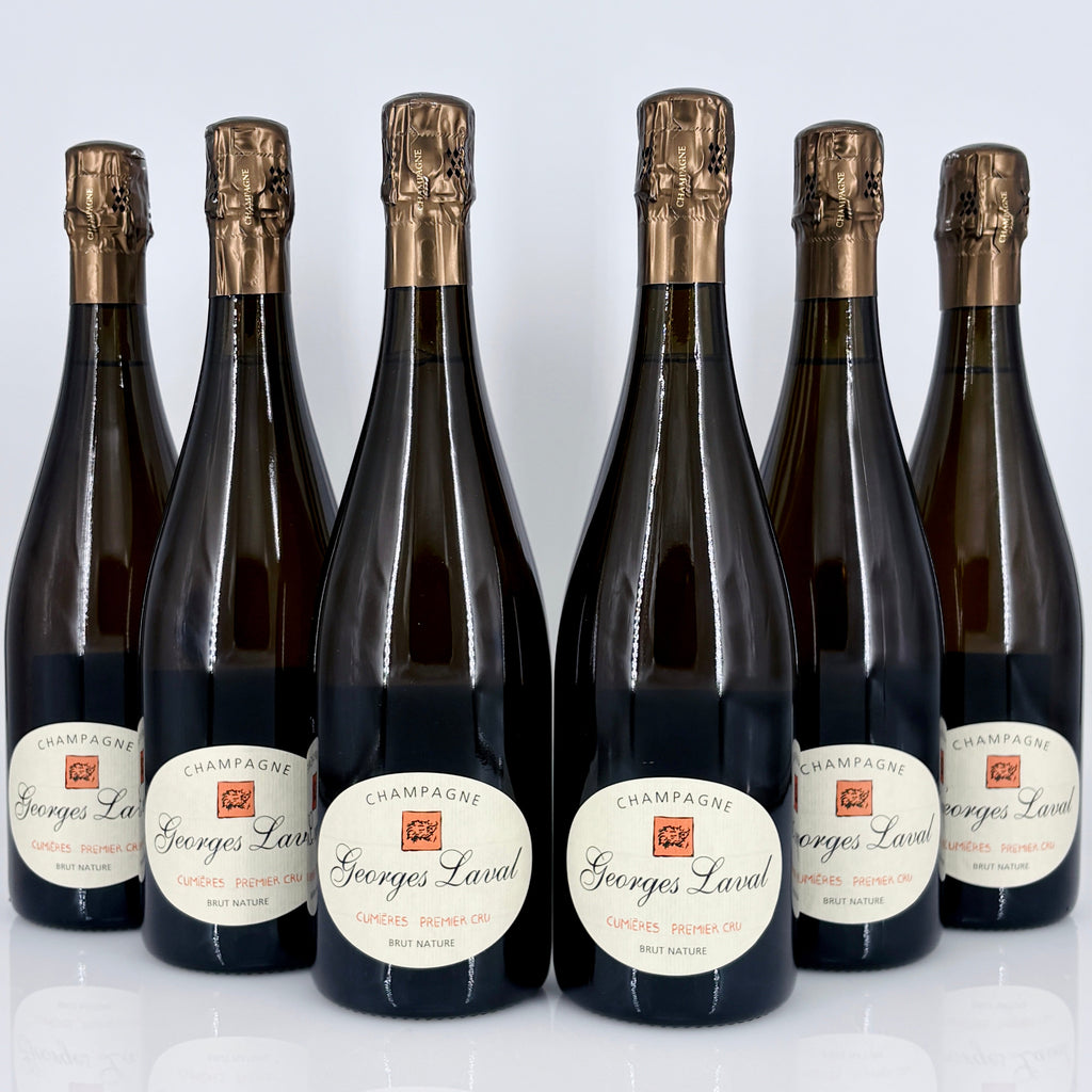 Six bottles of Georges Laval champagne on a white background