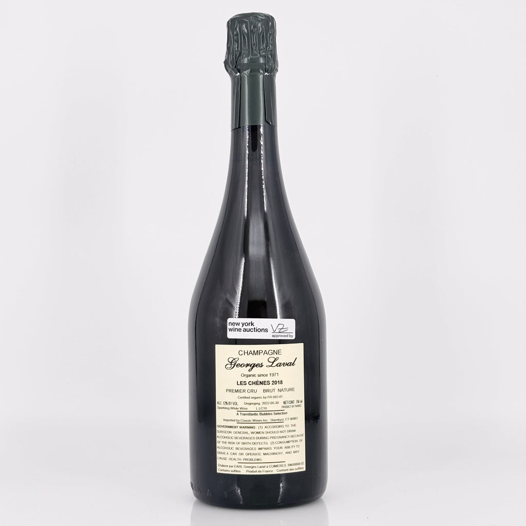Bottle of champagne with a label on a white background