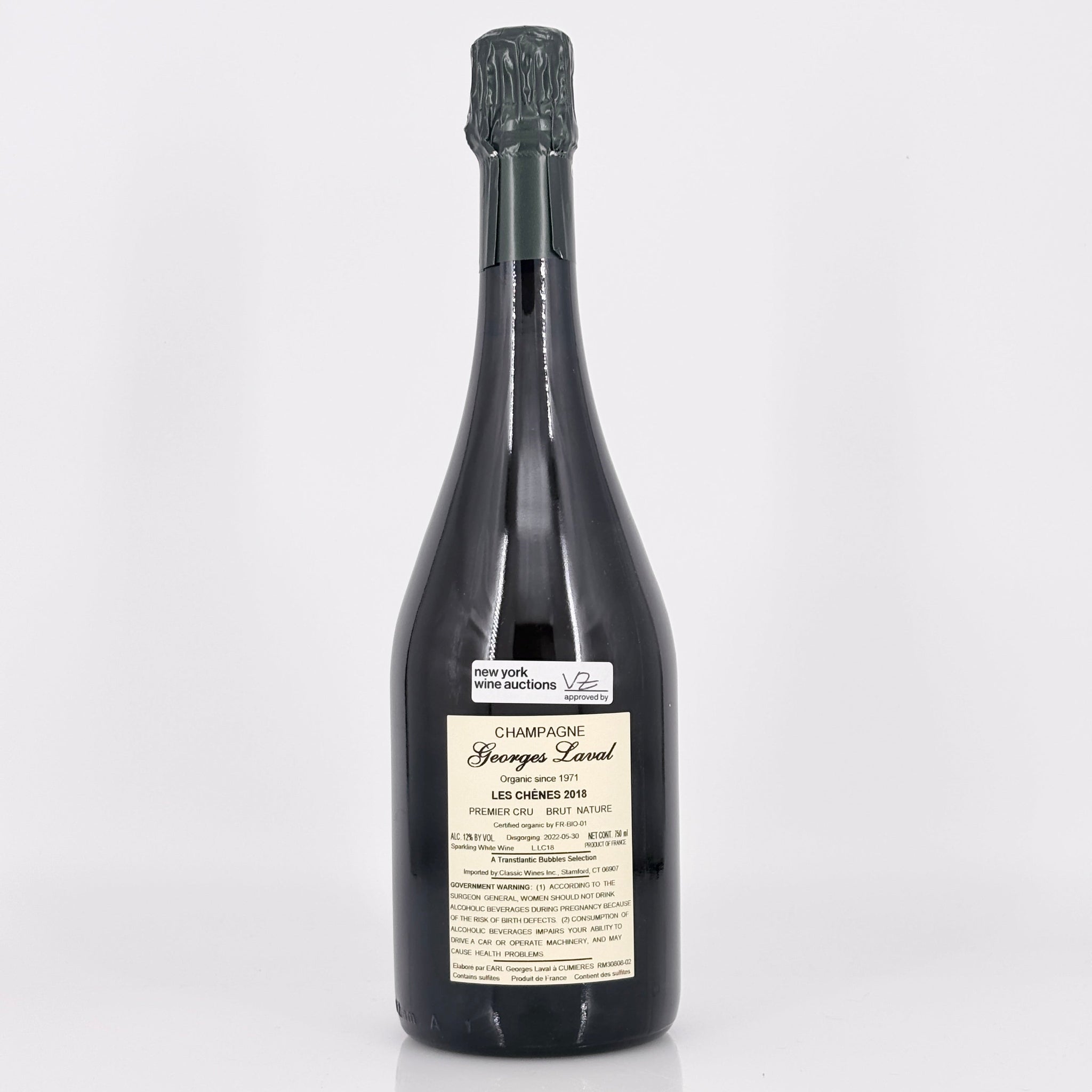 Bottle of champagne with a label on a white background
