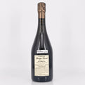 Bottle of champagne with a visible label on a white background