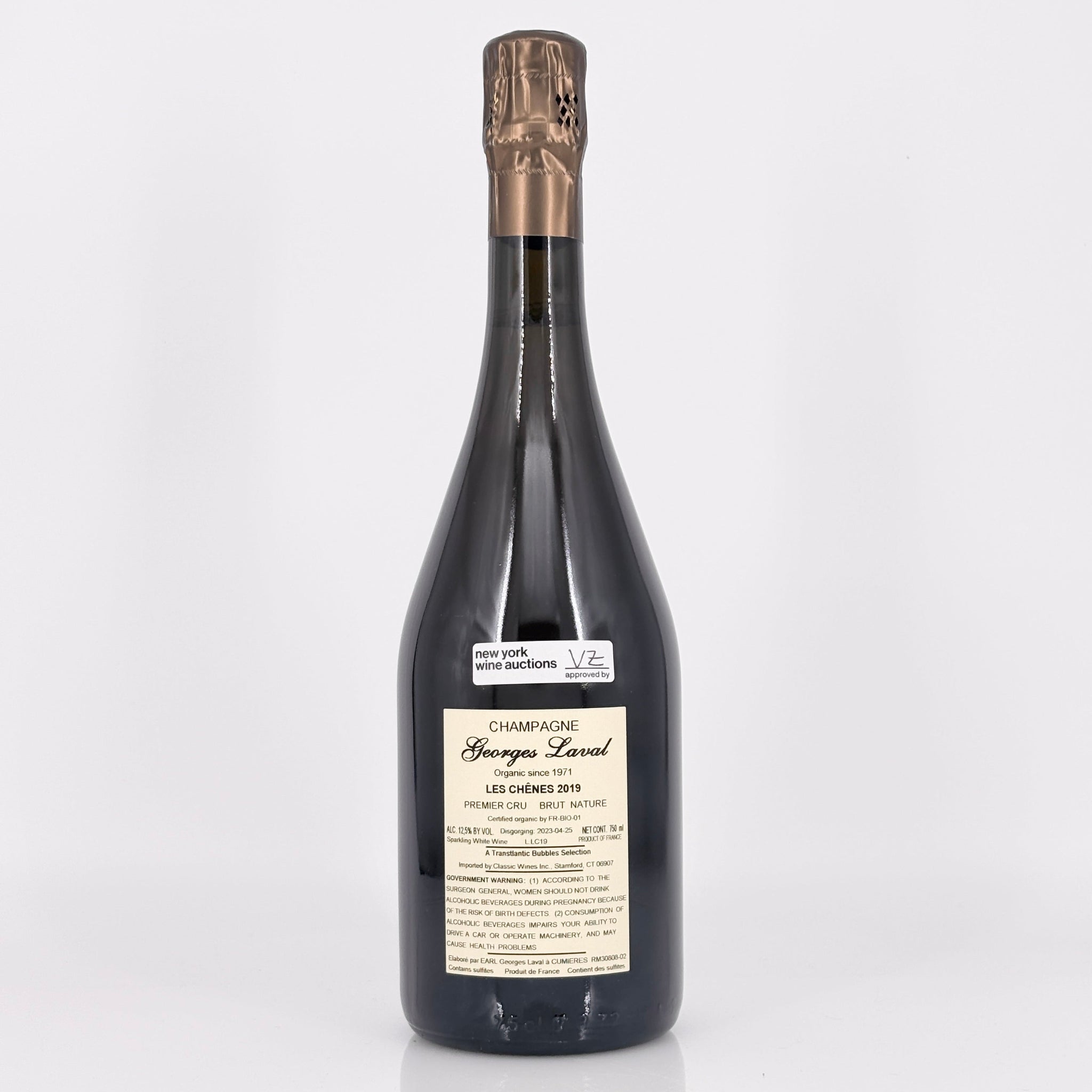 Bottle of champagne with a visible label on a white background