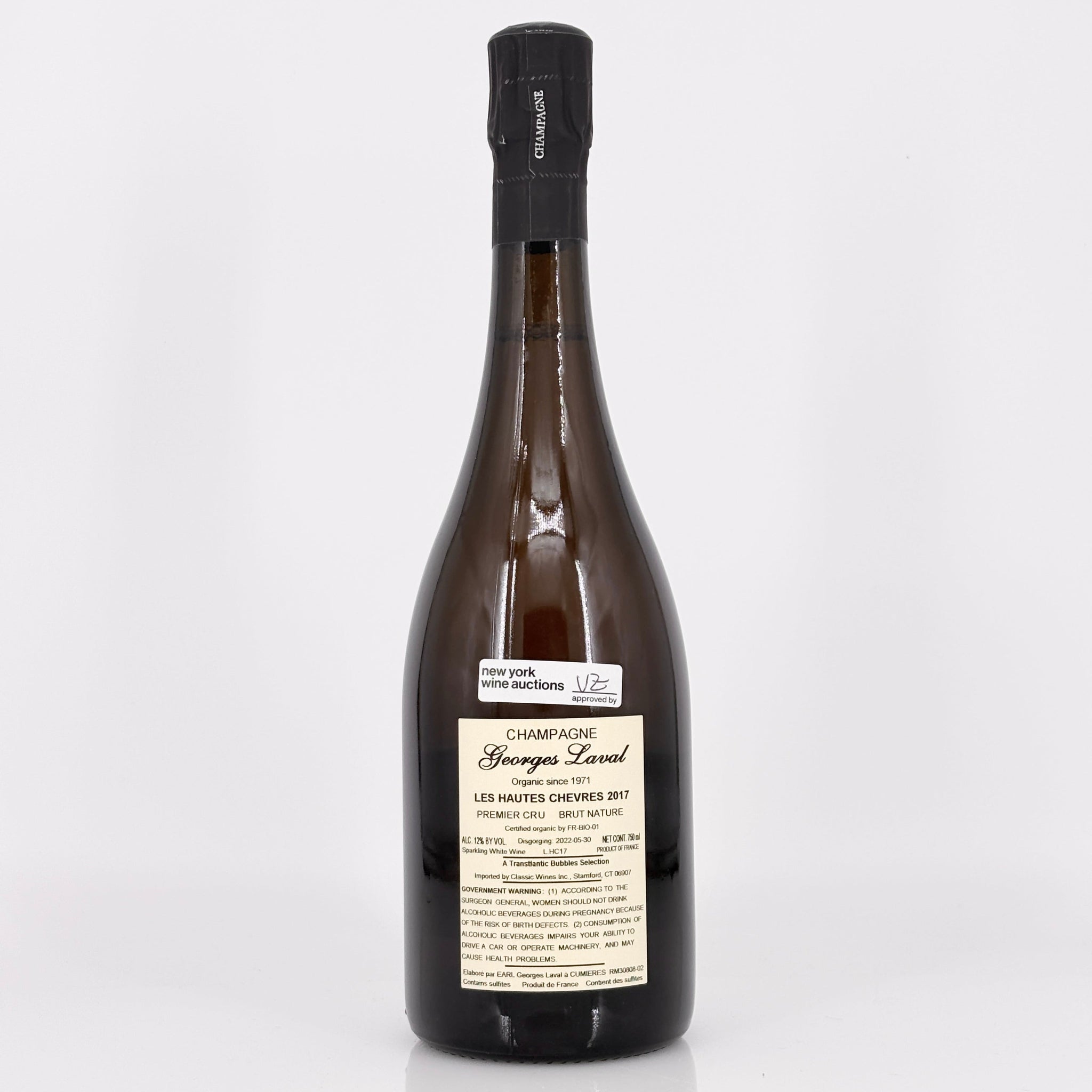 Wine bottle with a label on a white background