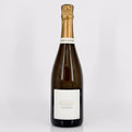 Wine bottle with a white label on a light gray background