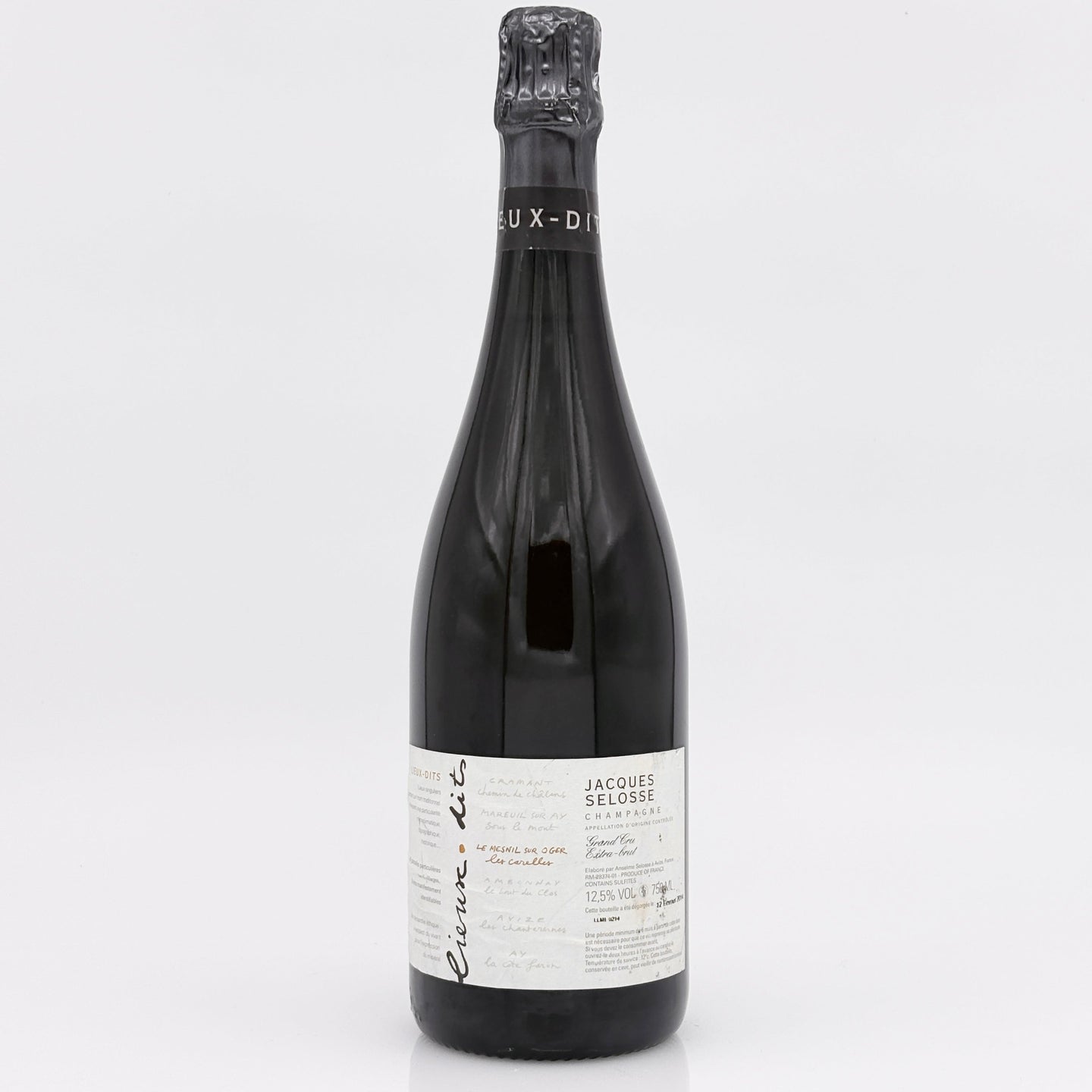 Wine bottle with a white label on a light gray background