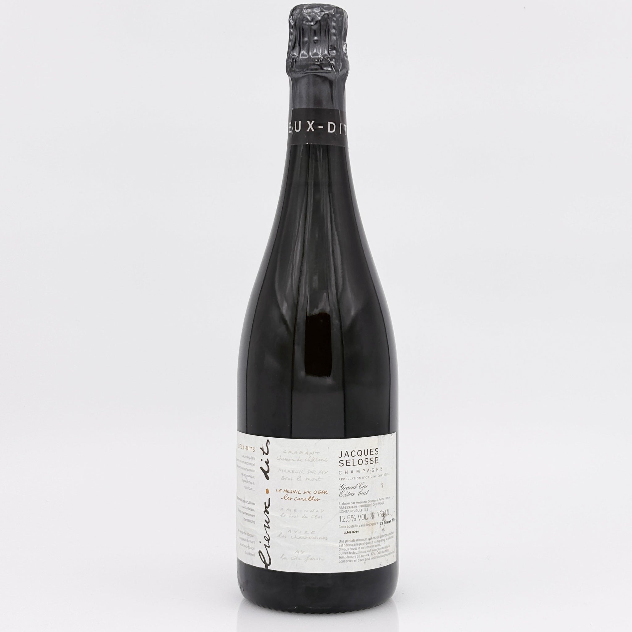 Wine bottle with a white label on a light gray background