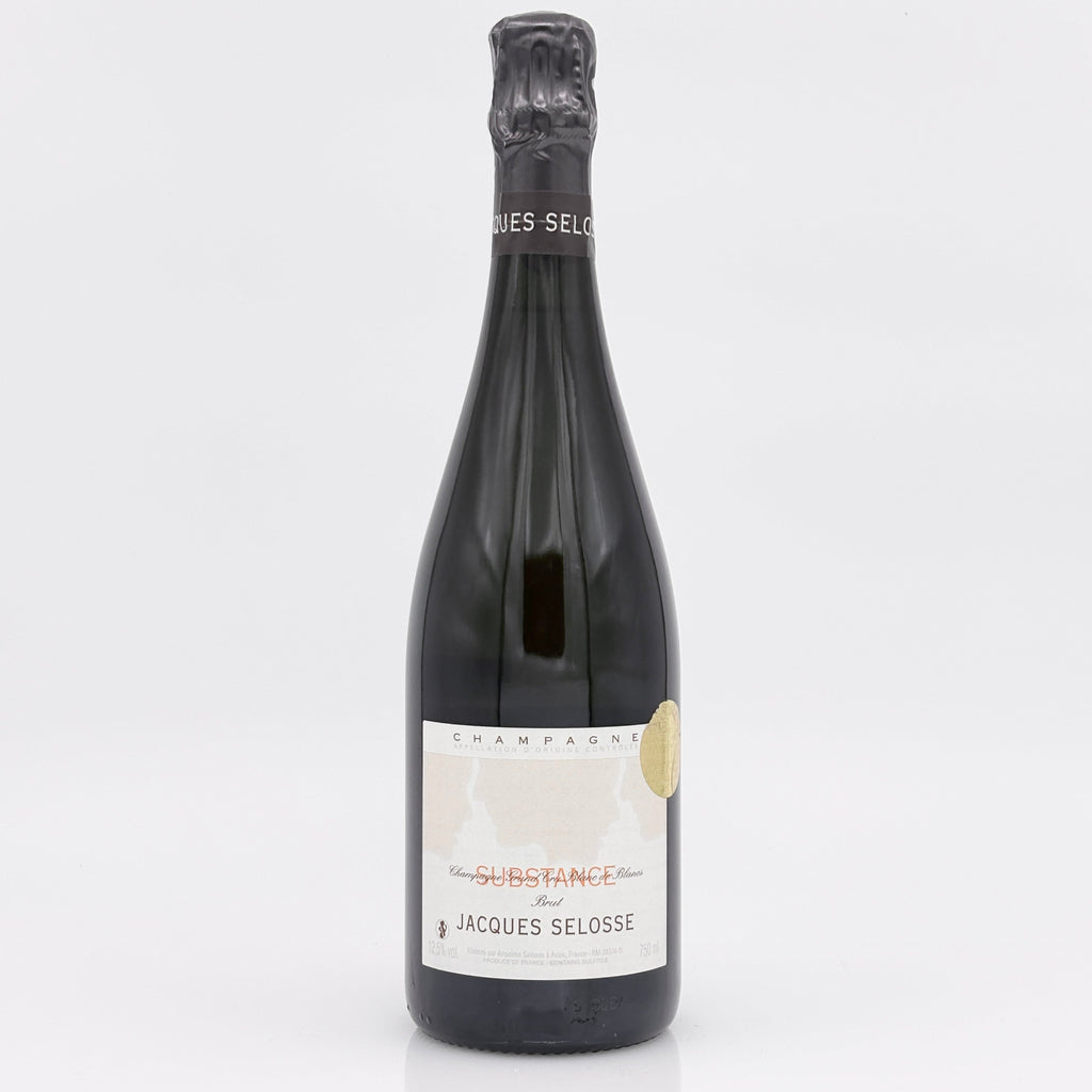 Bottle of Jacques Selosse champagne on a white background
