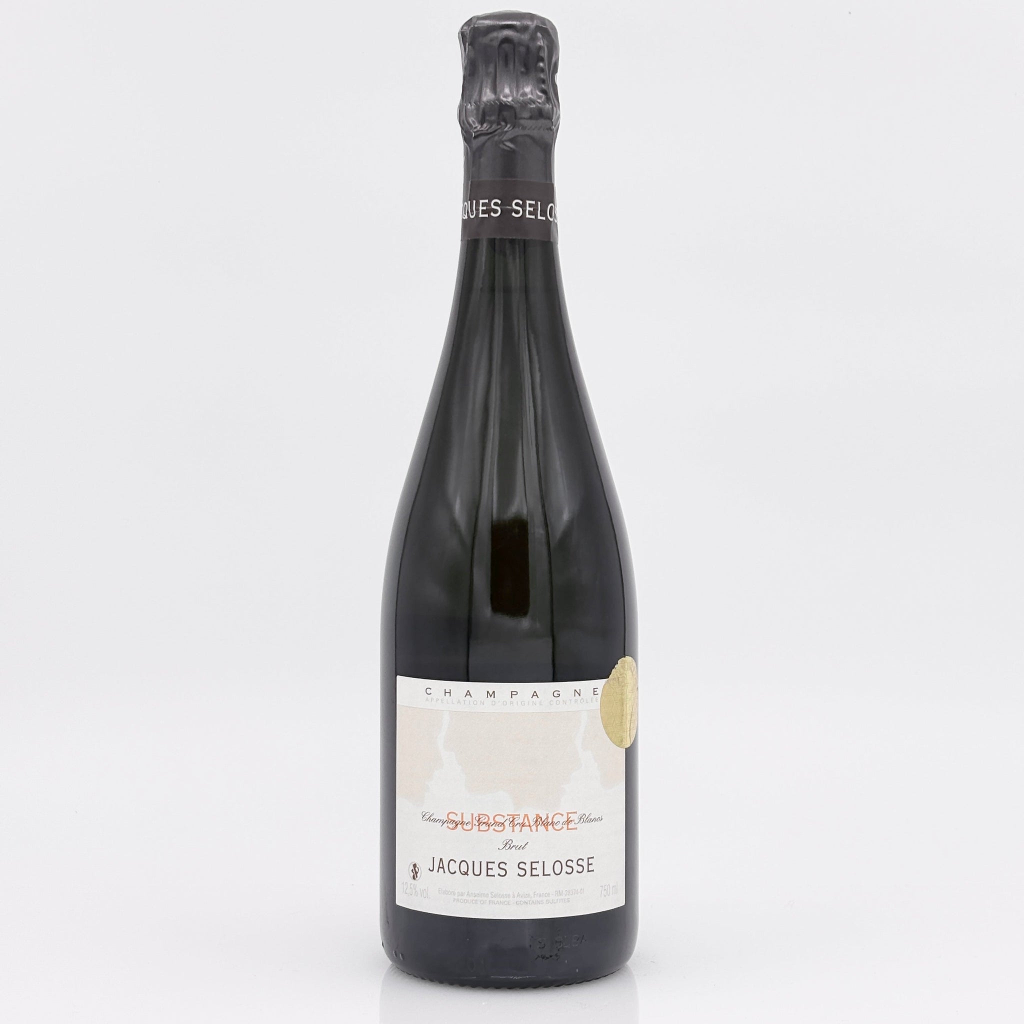 Bottle of Jacques Selosse champagne on a white background